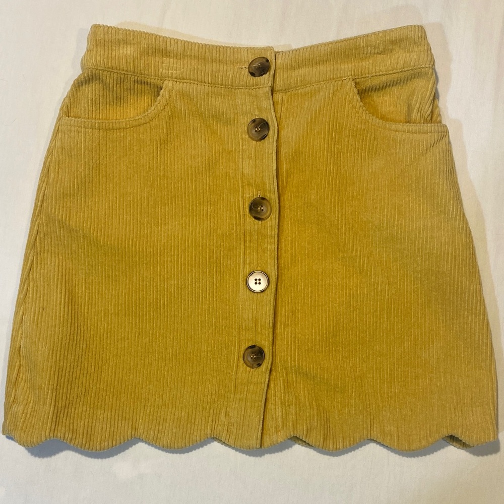 Day To Day Corduroy Button-Front Scallop Hem Mini Skirt - Mustard
Small